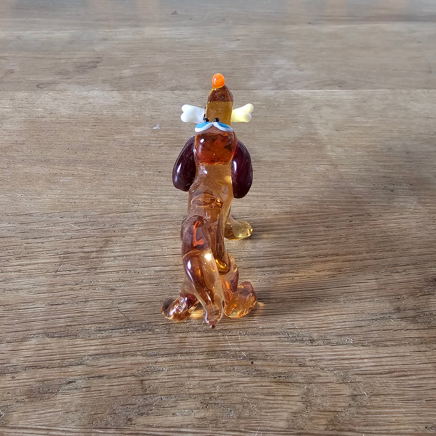 1970s Murano-style amber art glass daschund with bone figurine