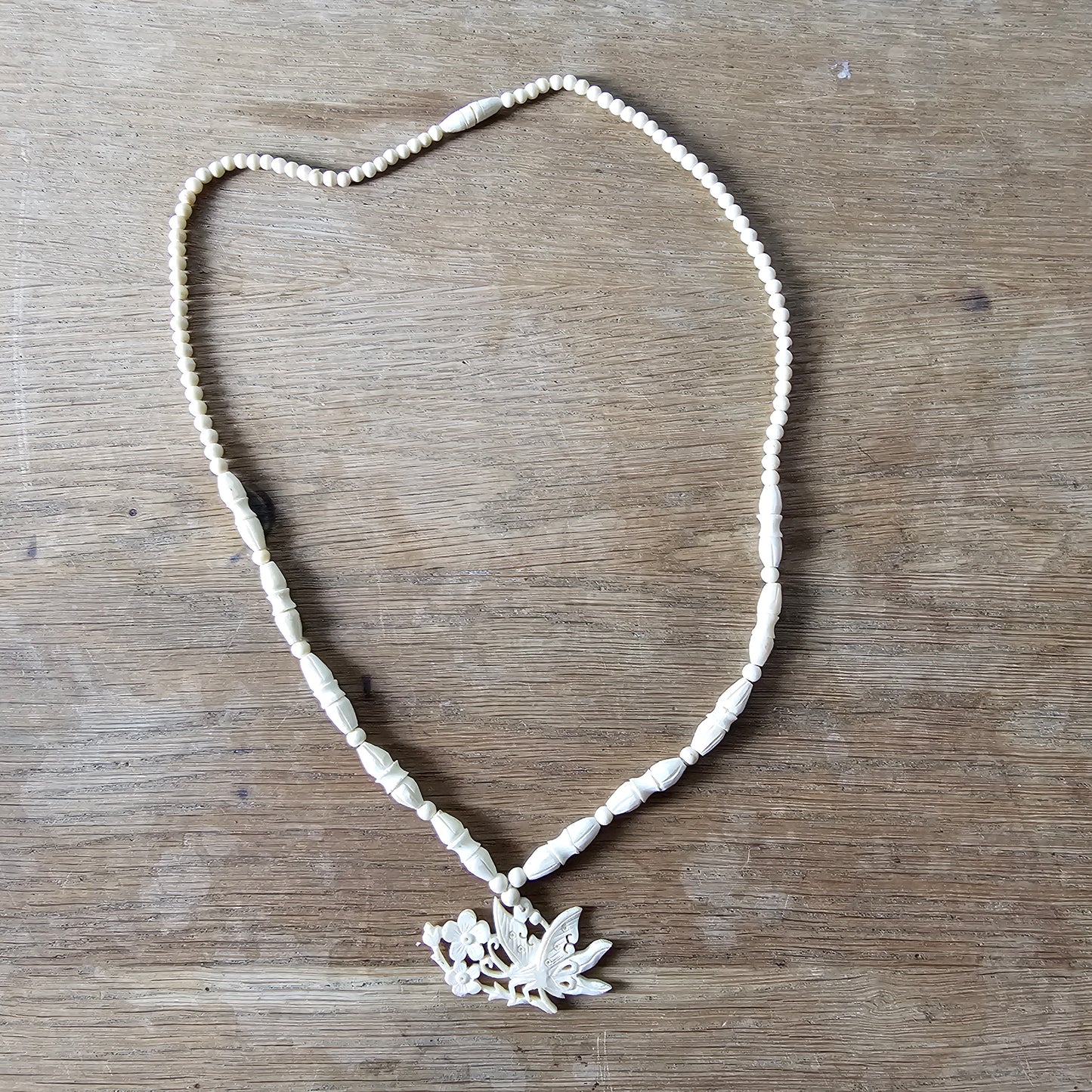 1940s carved bone butterfly & floral pendant bead necklace