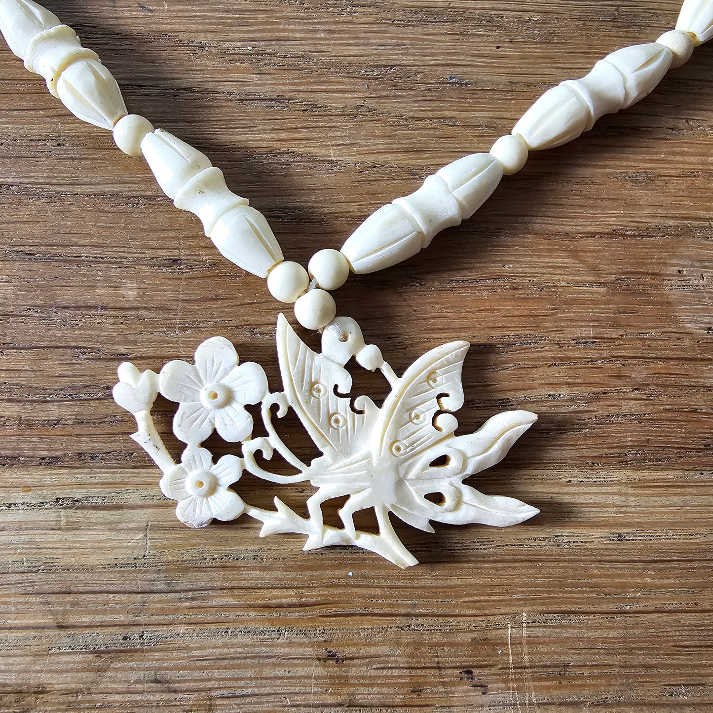 1940s carved bone butterfly & floral pendant bead necklace