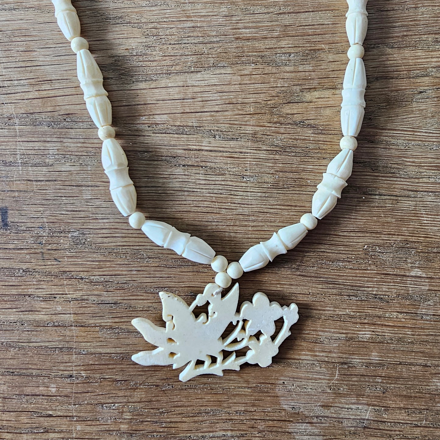 1940s carved bone butterfly & floral pendant bead necklace