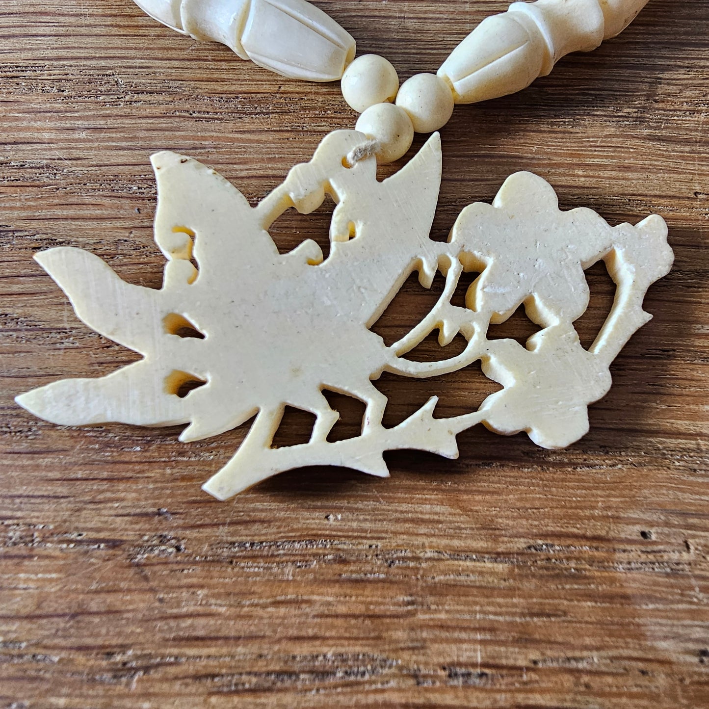 1940s carved bone butterfly & floral pendant bead necklace