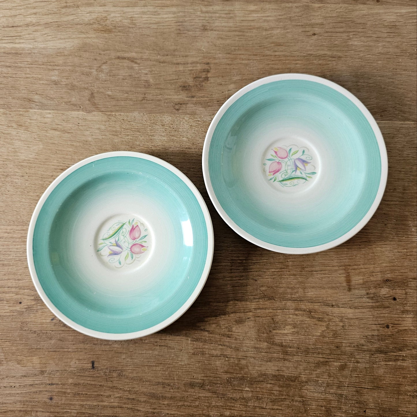 Pair of 1930s Susie Cooper "Dresden Spray" saucers