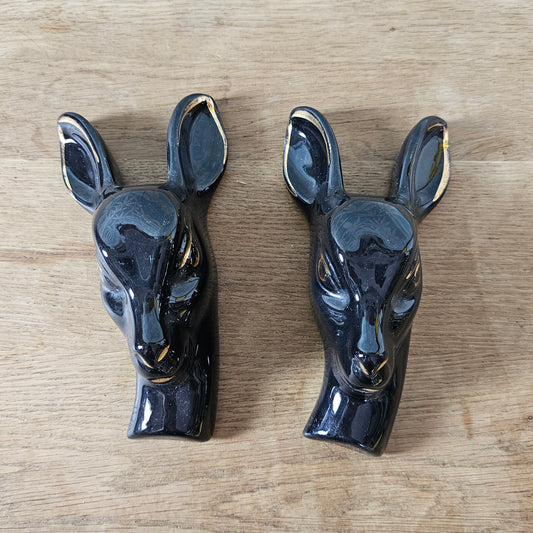 Pair of 1950s black ceramic deer head wall plaques with 22 carat gold detailing