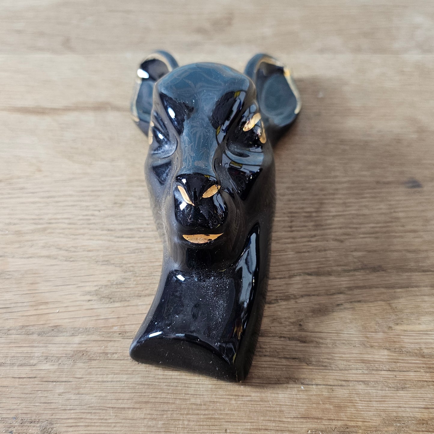 Pair of 1950s black ceramic deer head wall plaques with 22 carat gold detailing