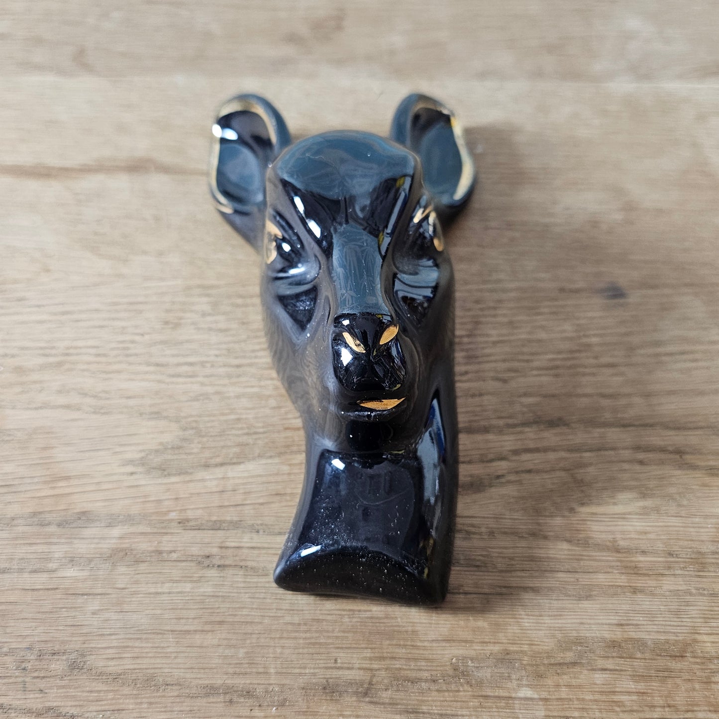 Pair of 1950s black ceramic deer head wall plaques with 22 carat gold detailing