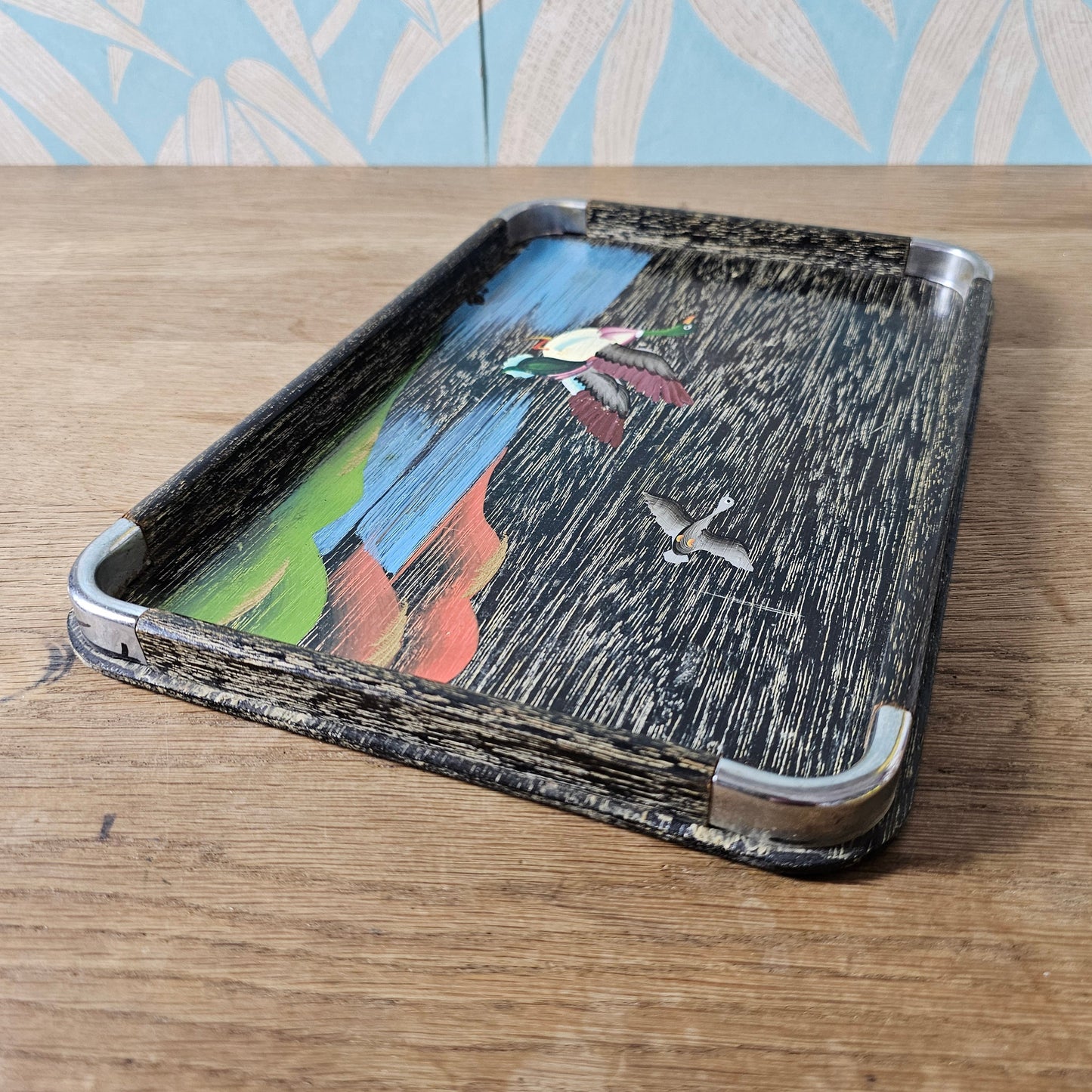 Set of three 1950s hand-painted black serving trays with flying duck detail
