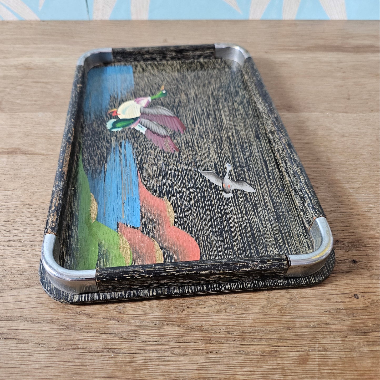 Set of three 1950s hand-painted black serving trays with flying duck detail