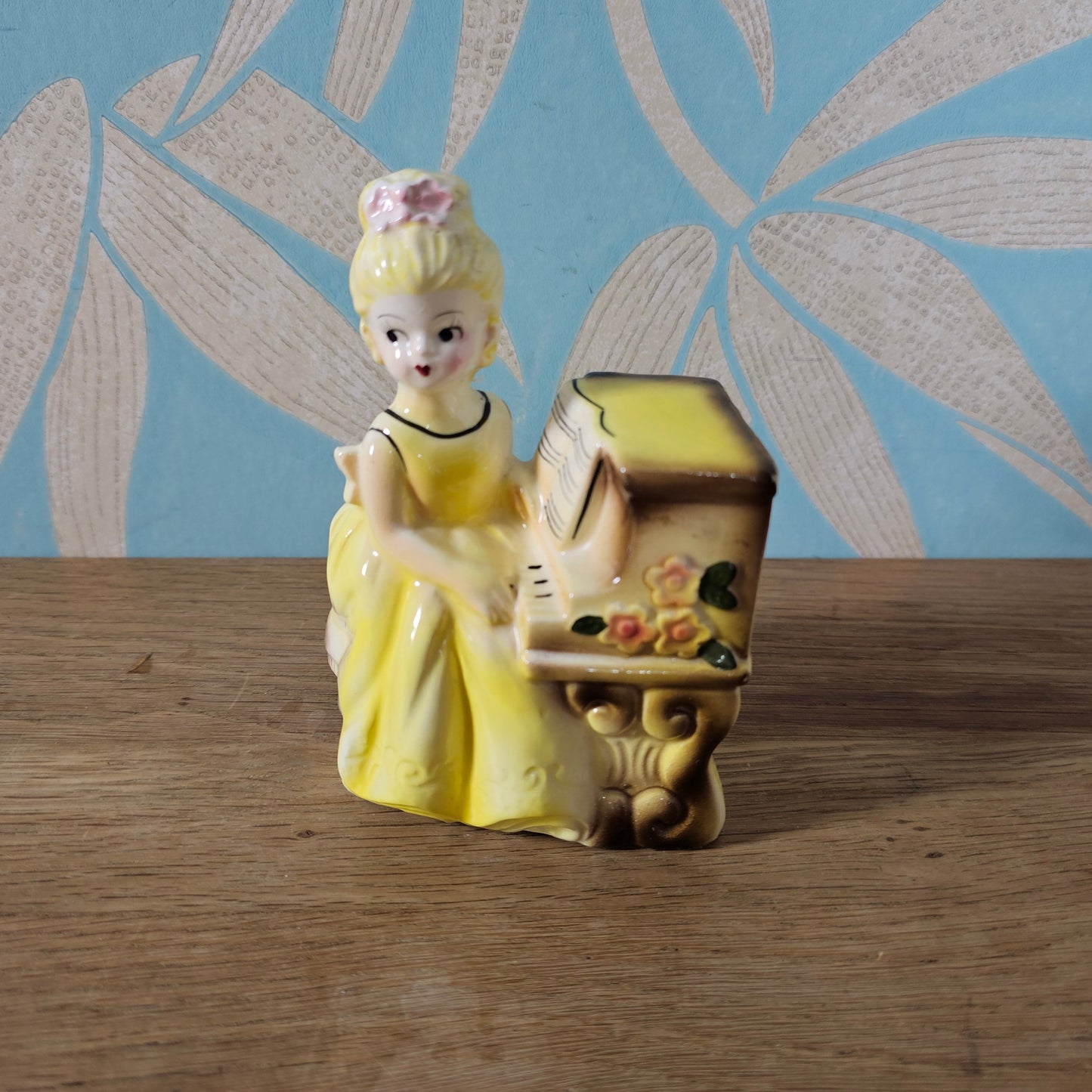 1950s girl in yellow dress playing piano ceramic bud vase figurine
