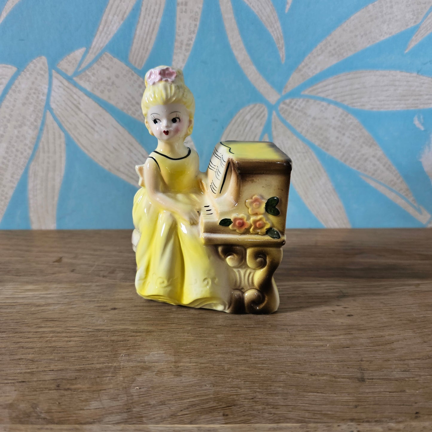 1950s girl in yellow dress playing piano ceramic bud vase figurine