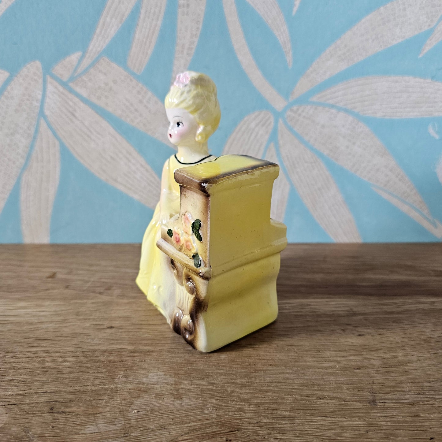 1950s girl in yellow dress playing piano ceramic bud vase figurine