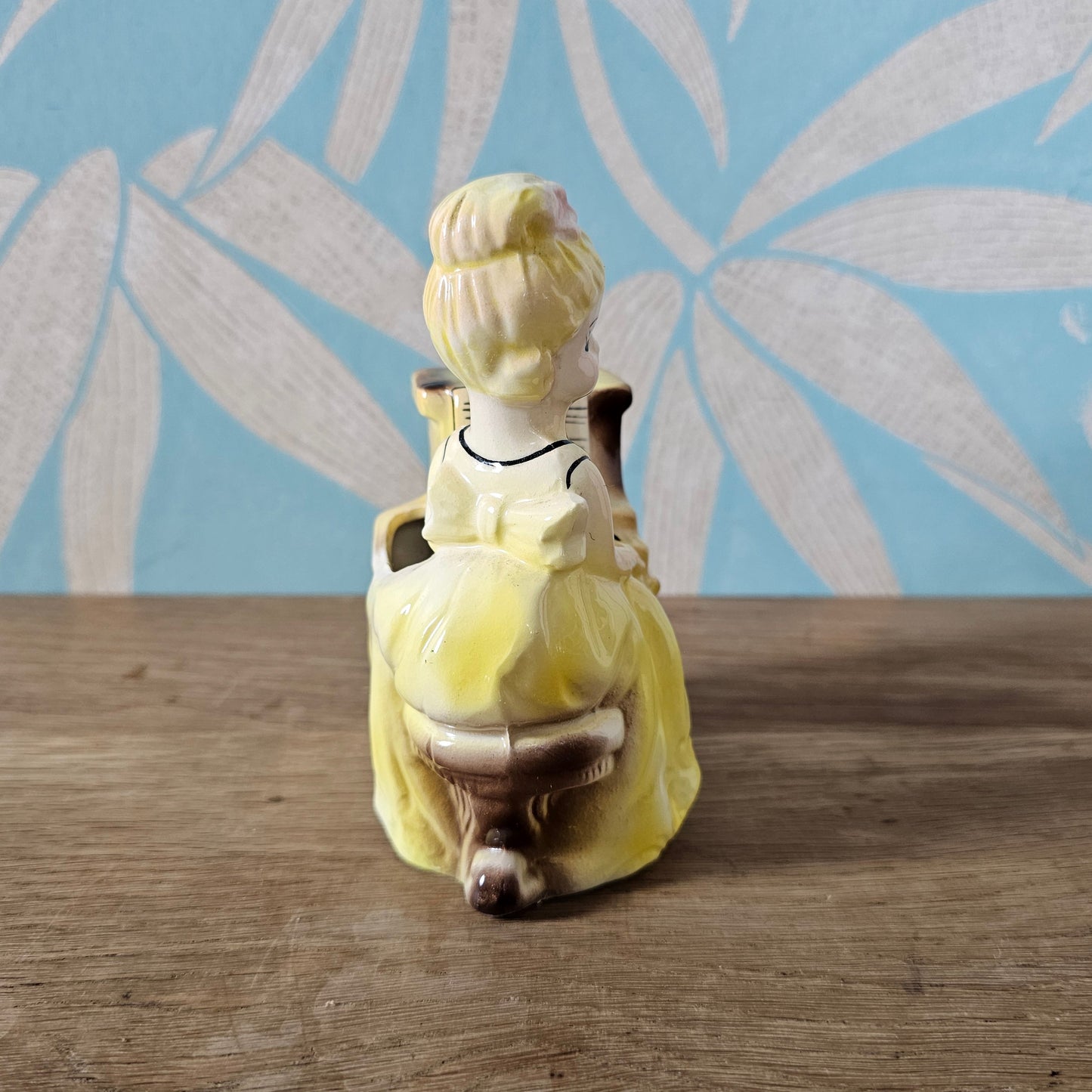 1950s girl in yellow dress playing piano ceramic bud vase figurine