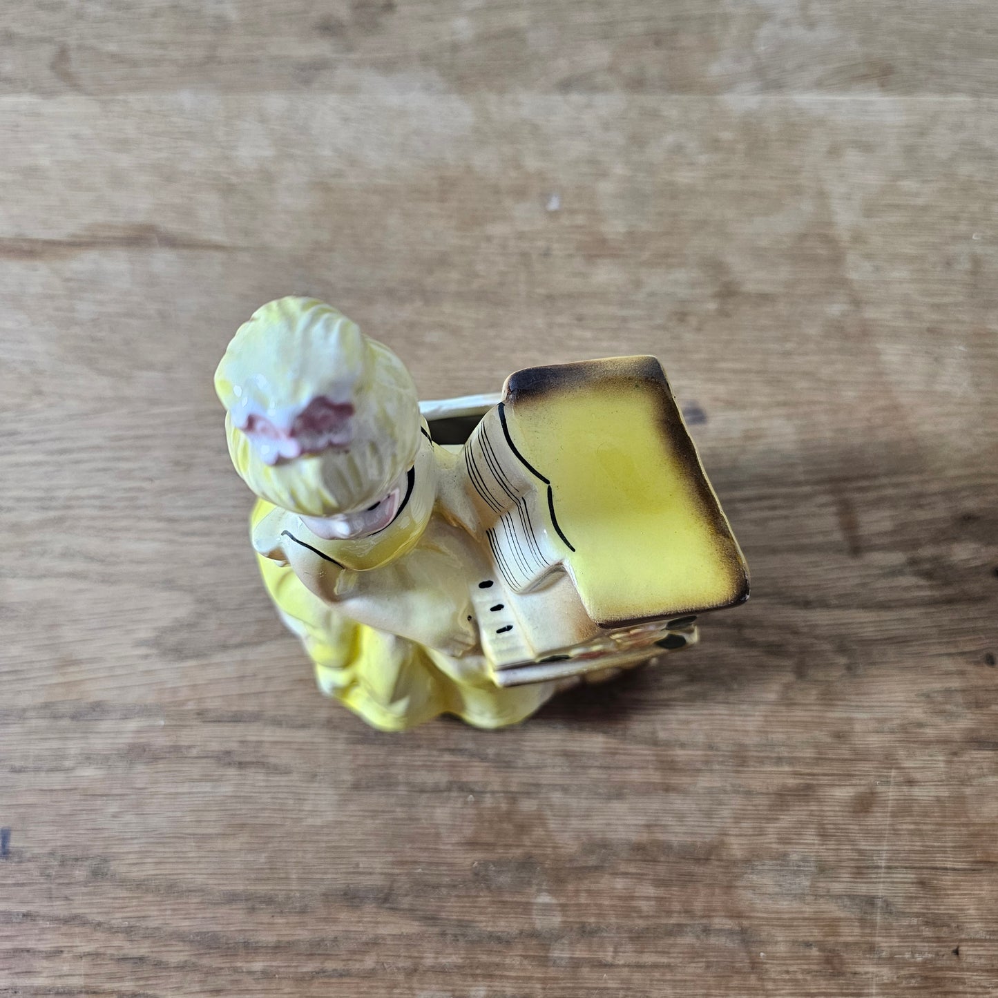 1950s girl in yellow dress playing piano ceramic bud vase figurine