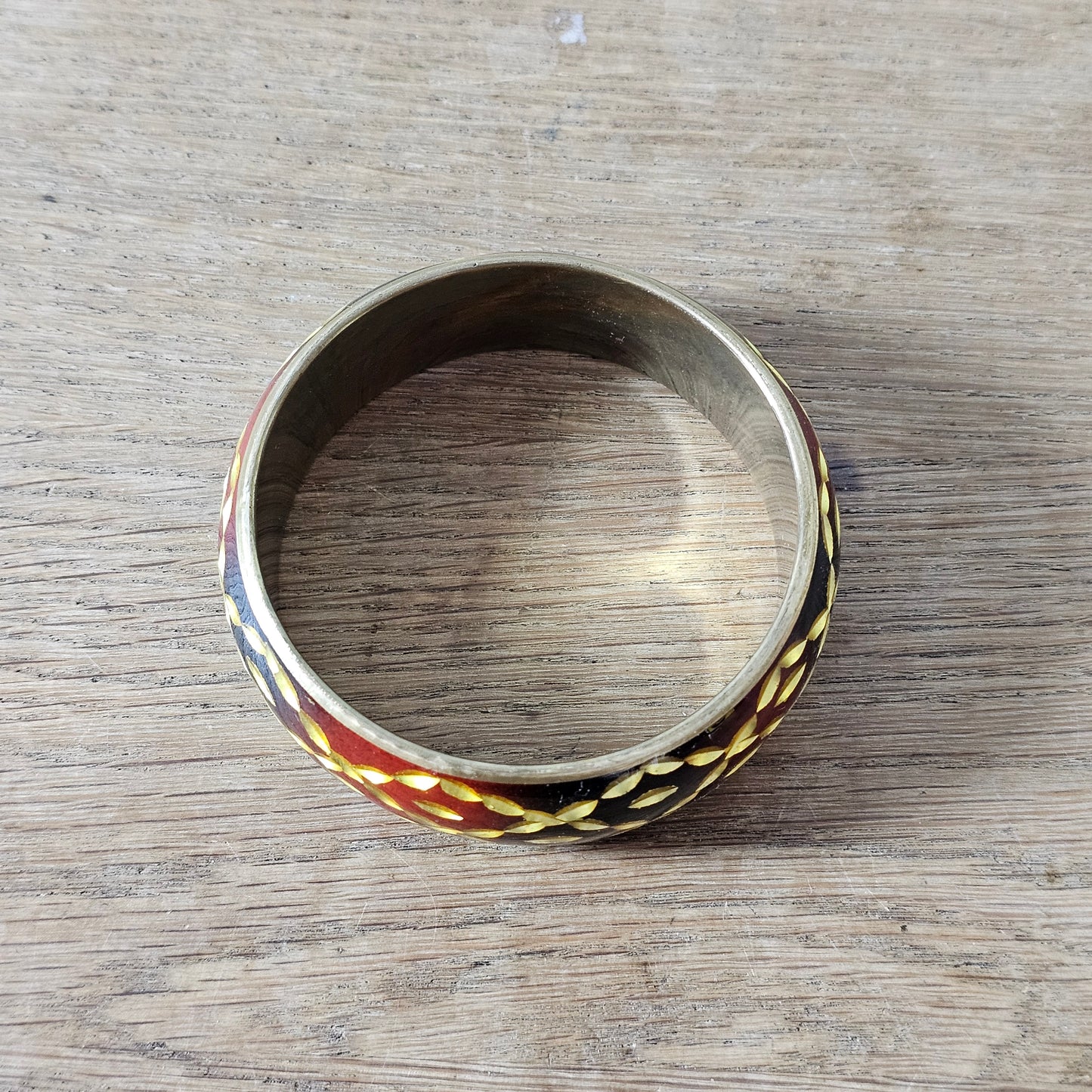 1980s burgundy black & gold leaf-effect resin domed bangle
