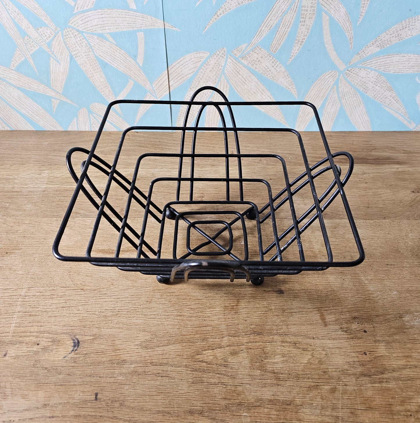 Mid-century atomic black wire fruit basket with ball feet