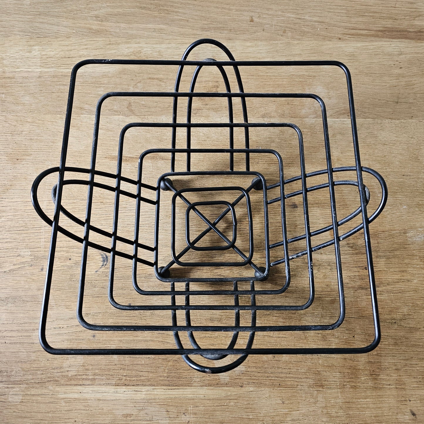 Mid-century atomic black wire fruit basket with ball feet