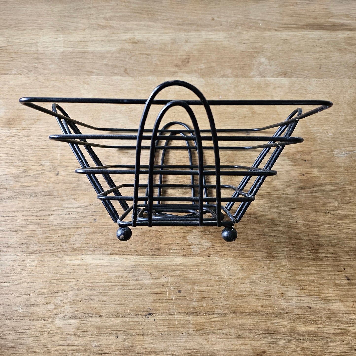 Mid-century atomic black wire fruit basket with ball feet