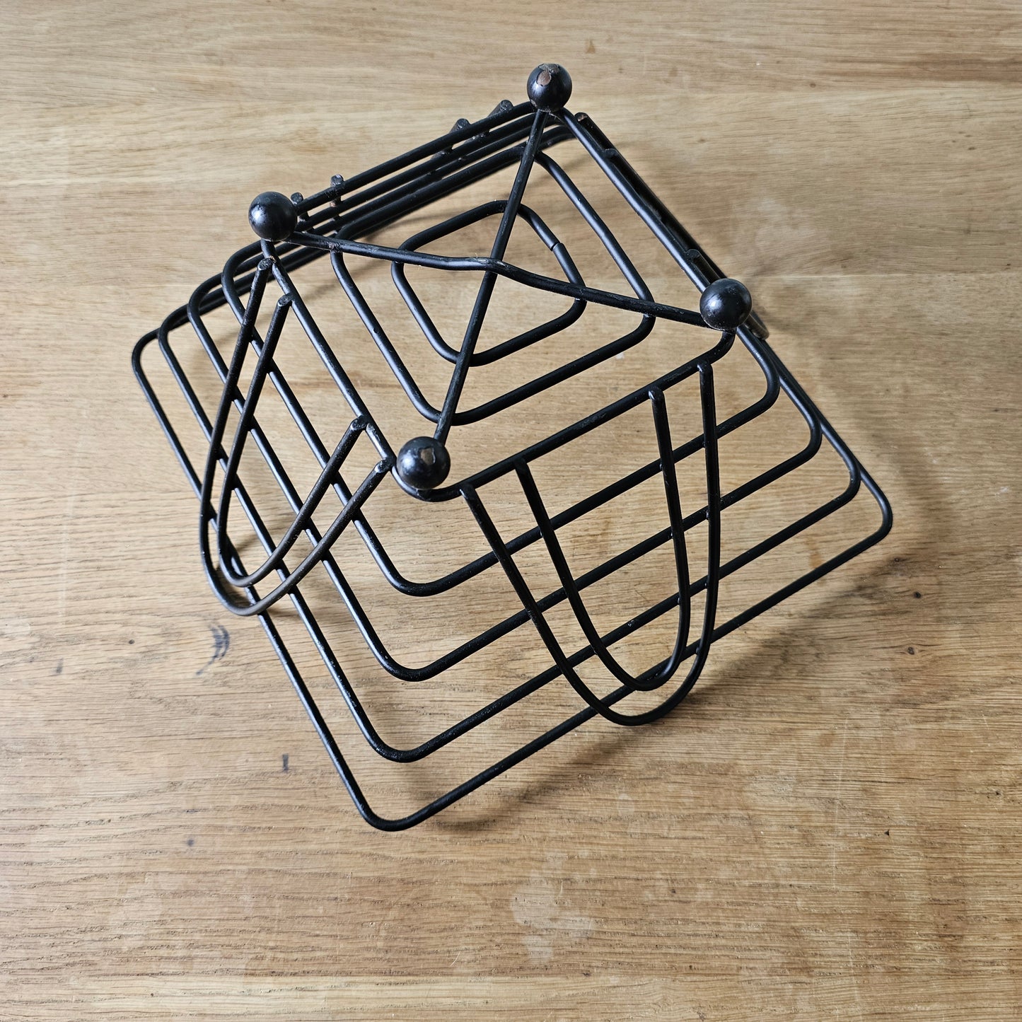 Mid-century atomic black wire fruit basket with ball feet