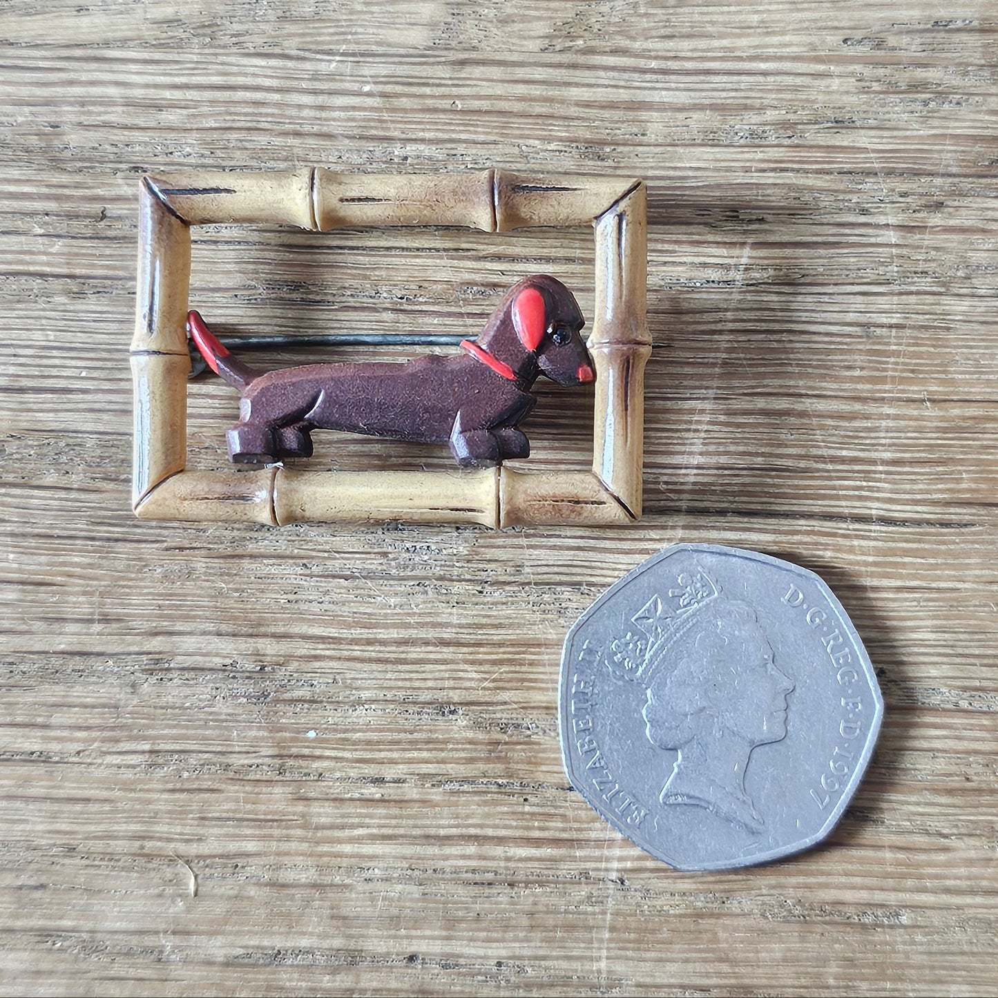 1930s/40s acrylic Dachshund dog in faux bamboo frame brooch