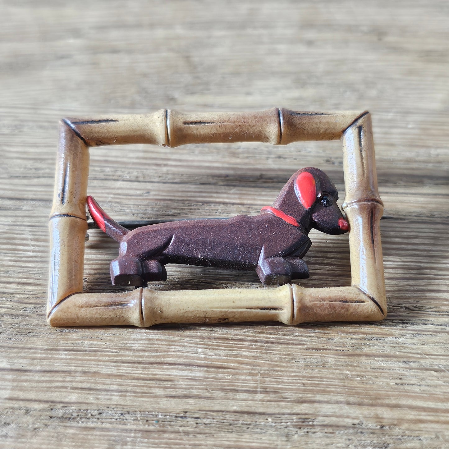 1930s/40s acrylic Dachshund dog in faux bamboo frame brooch