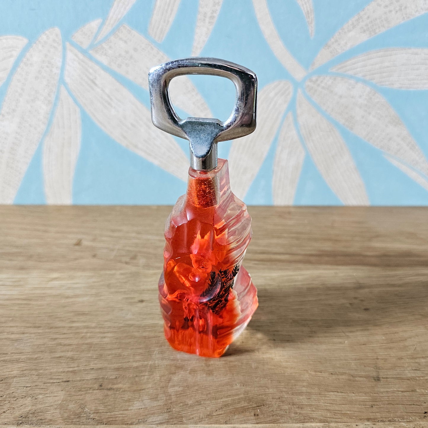 1950s red lucite seaside souvenir bottle opener with embedded shells