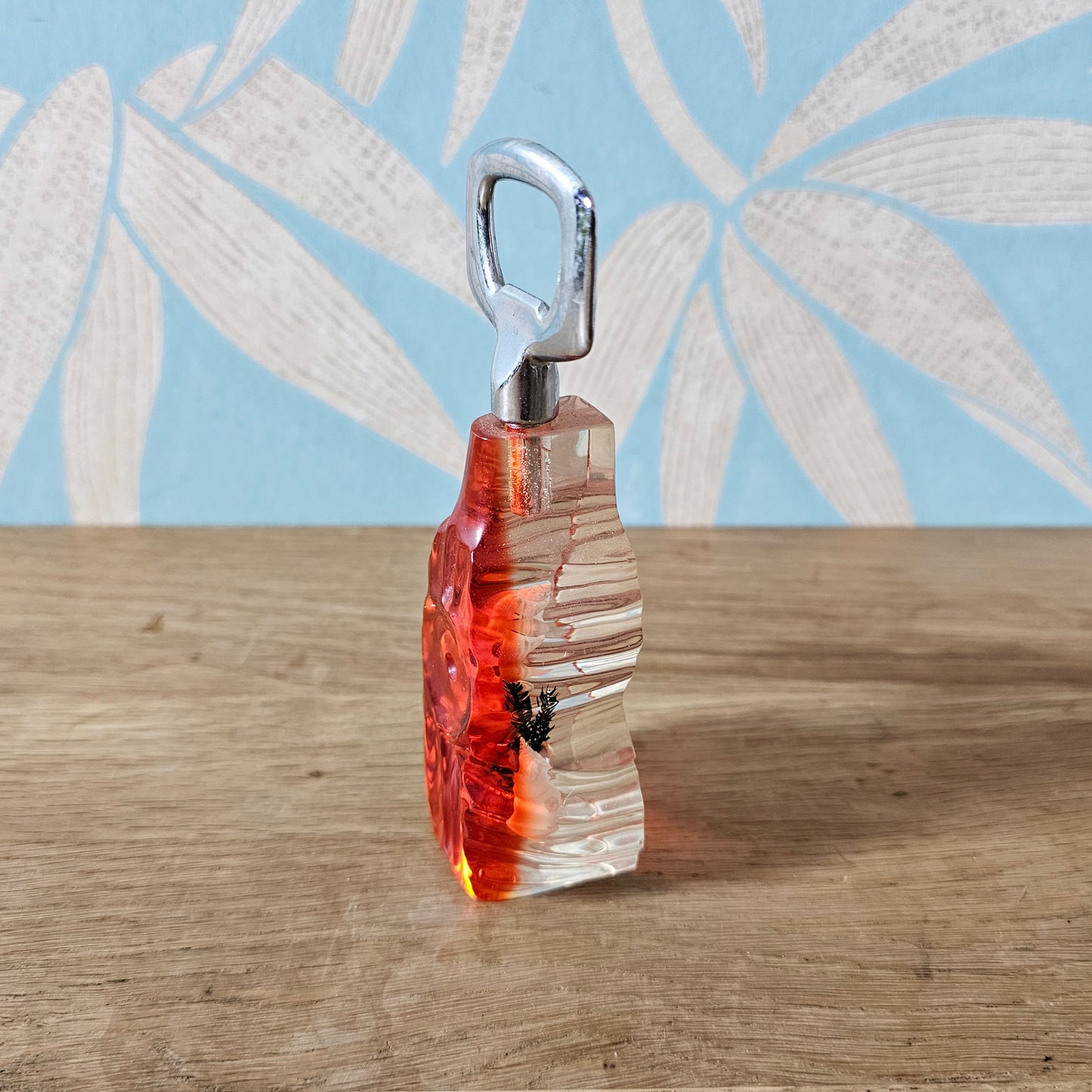 1950s red lucite seaside souvenir bottle opener with embedded shells