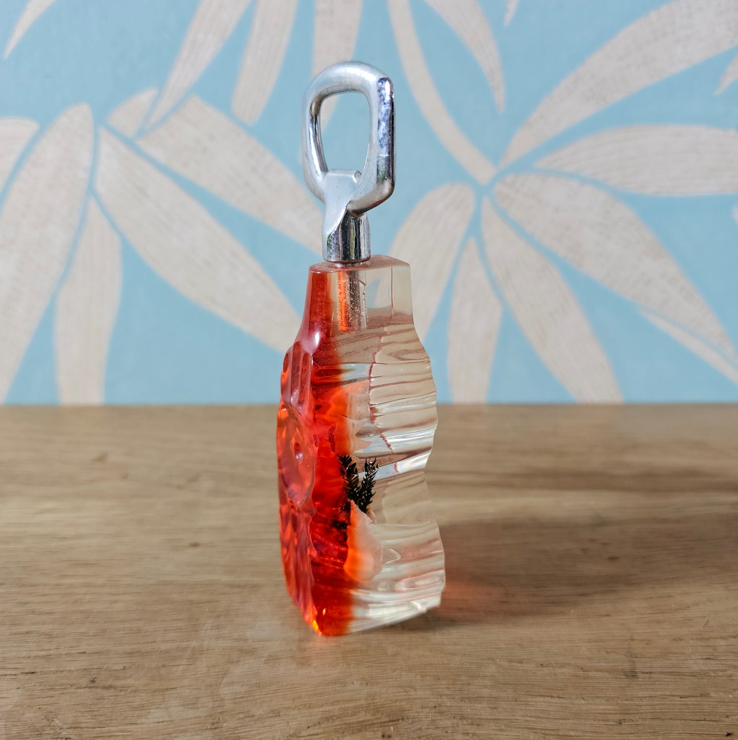 1950s red lucite seaside souvenir bottle opener with embedded shells