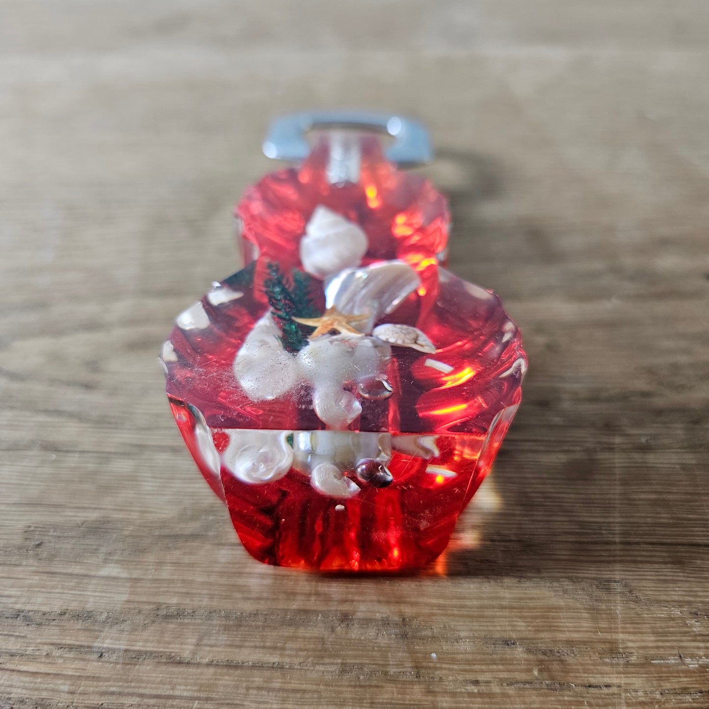 1950s red lucite seaside souvenir bottle opener with embedded shells
