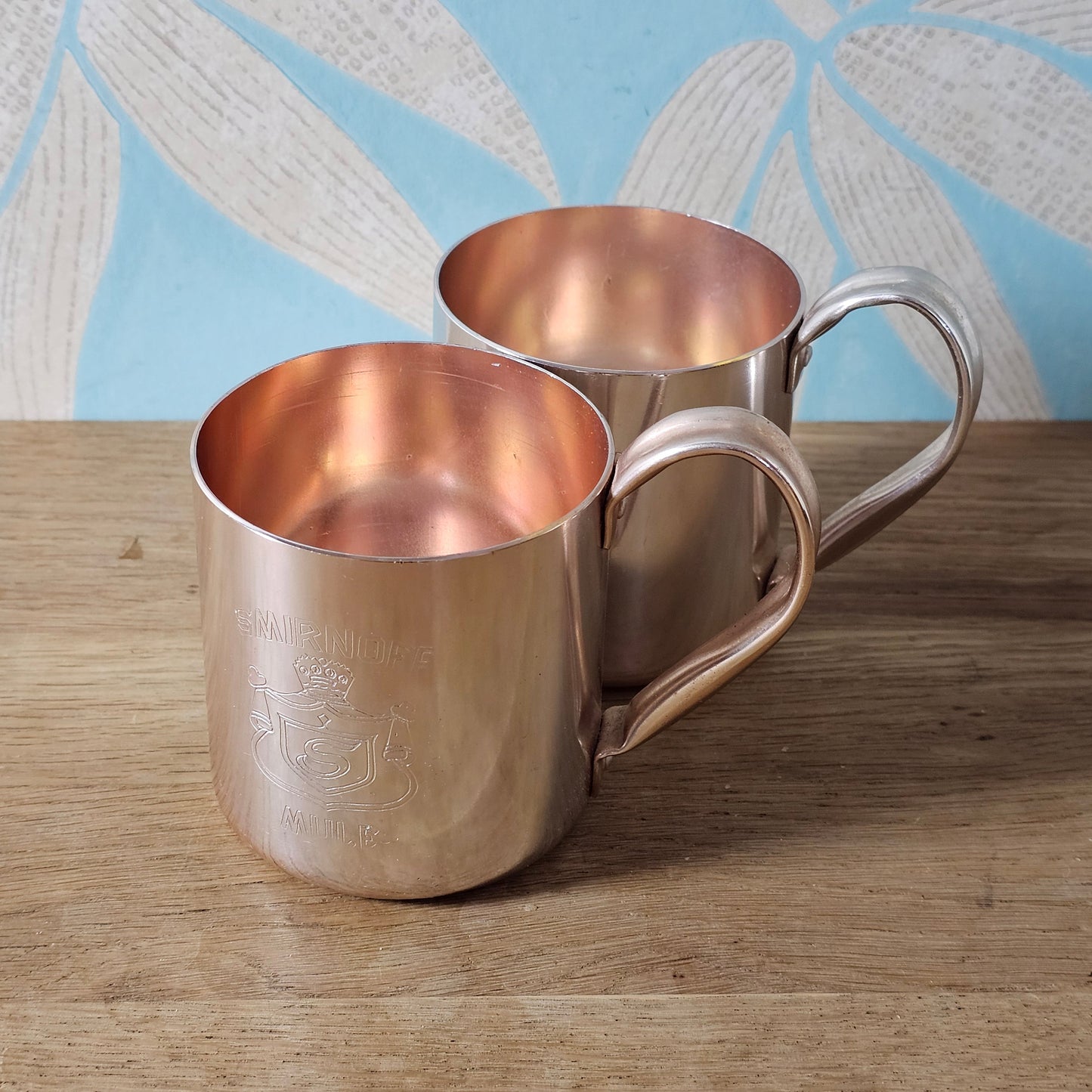 Pair of vintage Smirnoff rose-gold & copper mule mugs