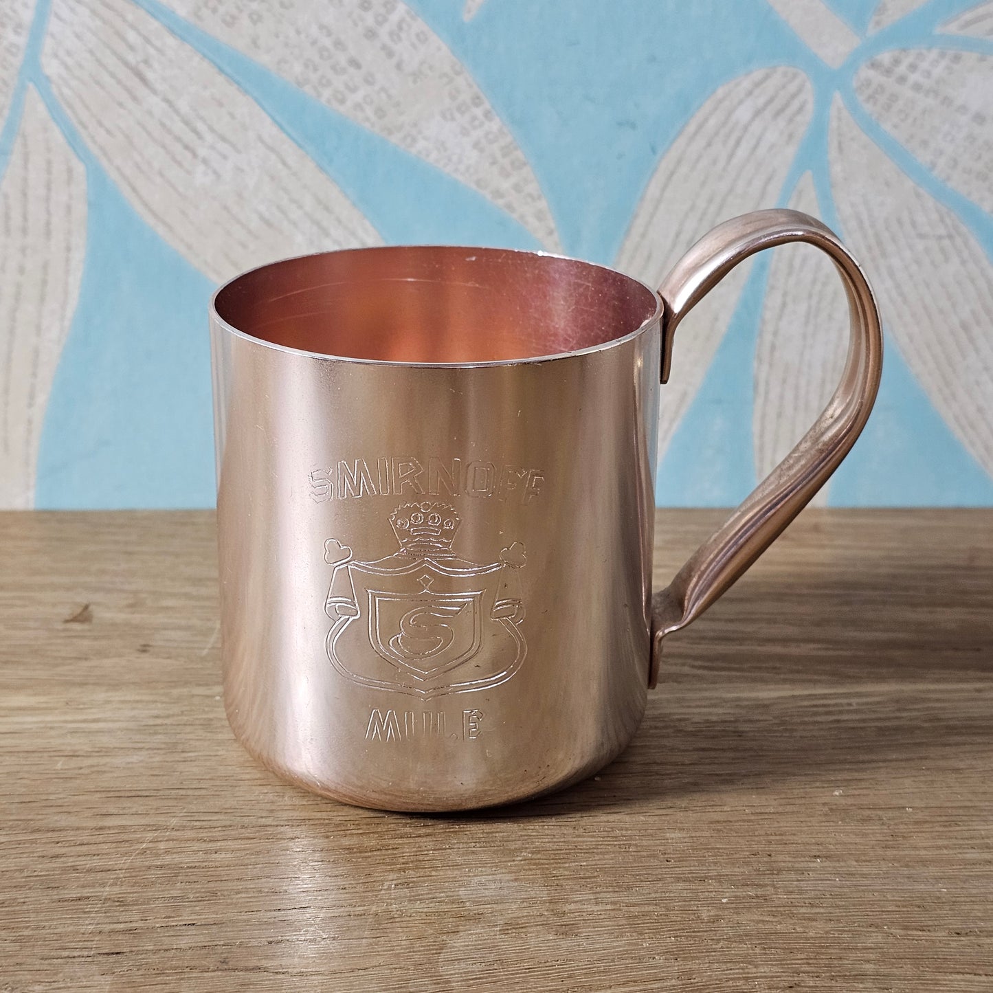 Pair of vintage Smirnoff rose-gold & copper mule mugs