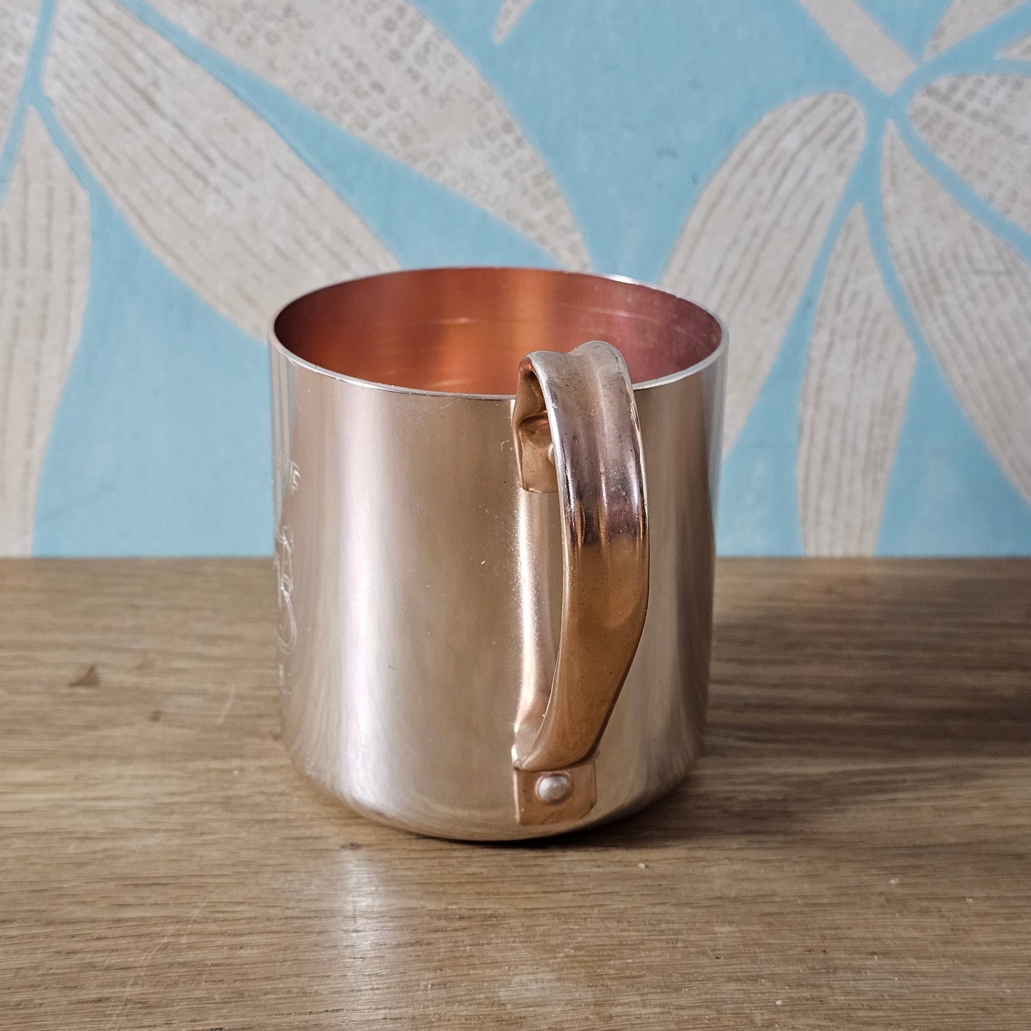 Pair of vintage Smirnoff rose-gold & copper mule mugs