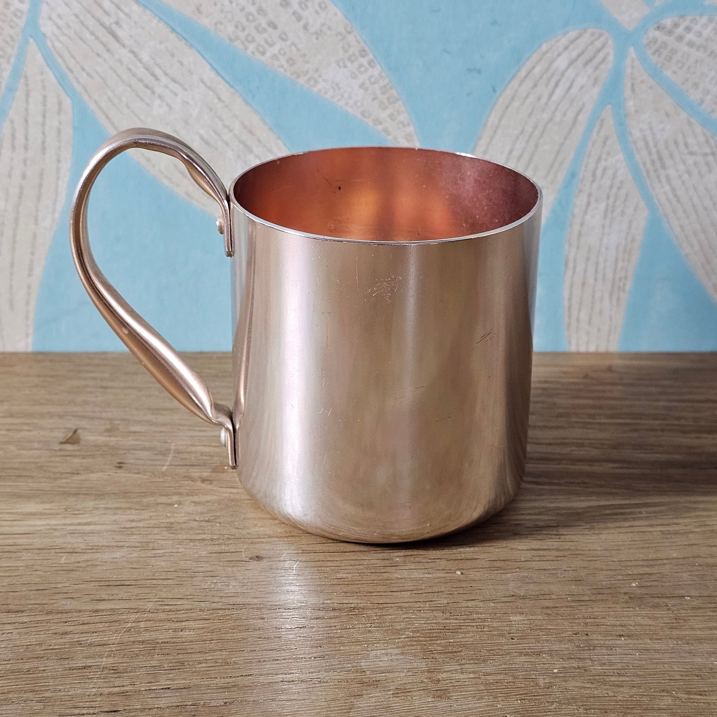 Pair of vintage Smirnoff rose-gold & copper mule mugs
