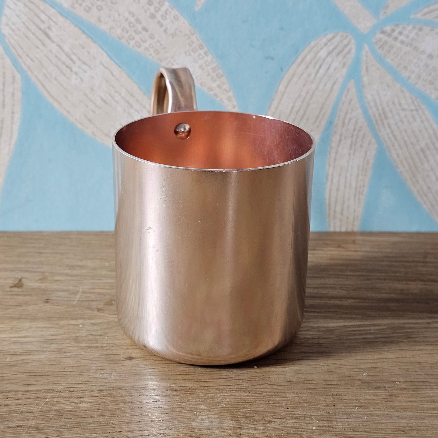 Pair of vintage Smirnoff rose-gold & copper mule mugs
