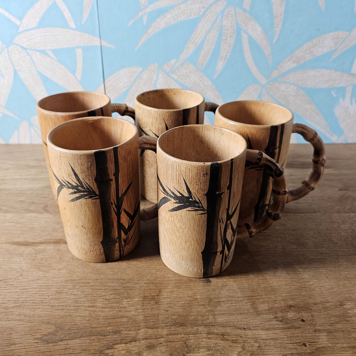 Set of five 1970s hand-painted bamboo wood tankards