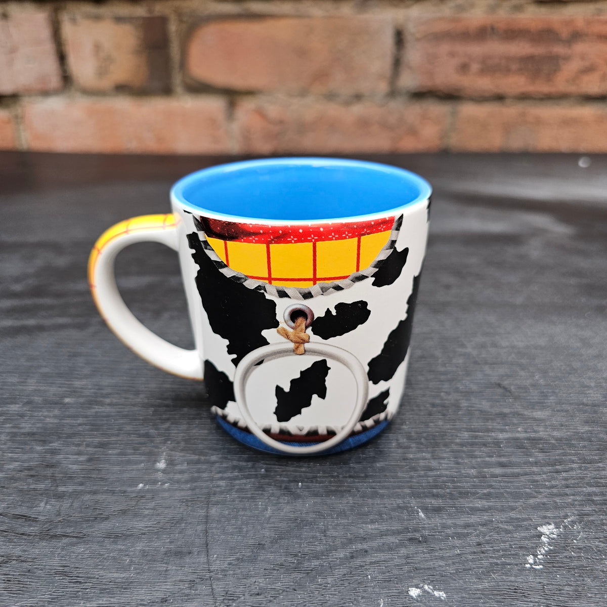 Disney Store Exclusive Toy Story Woody costume mug with blue interior