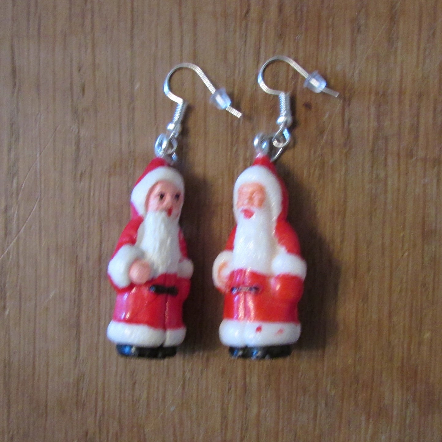 Kitsch home-made earrings made using vintage plastic Santa cake toppers