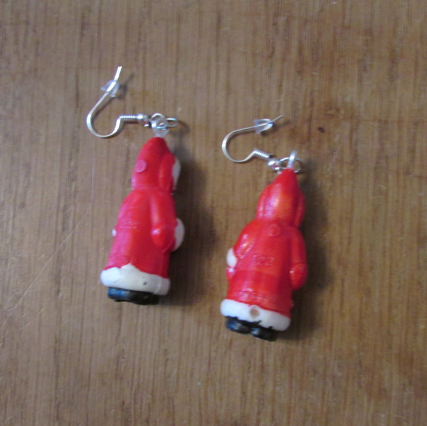 Kitsch home-made earrings made using vintage plastic Santa cake toppers