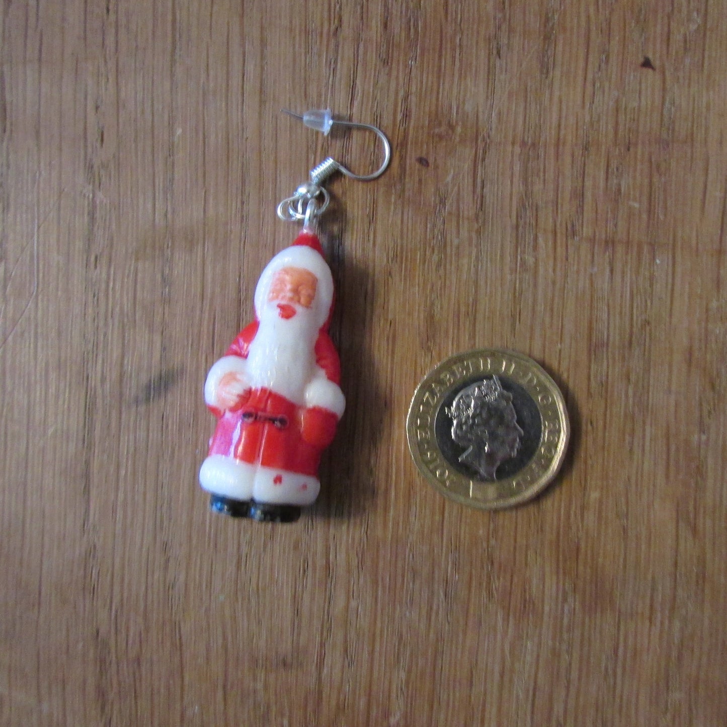 Kitsch home-made earrings made using vintage plastic Santa cake toppers