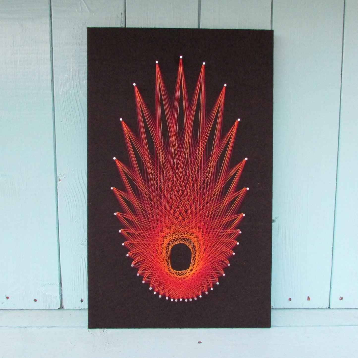 Home-made "Starburst" string art made from original 1973 pattern, black background