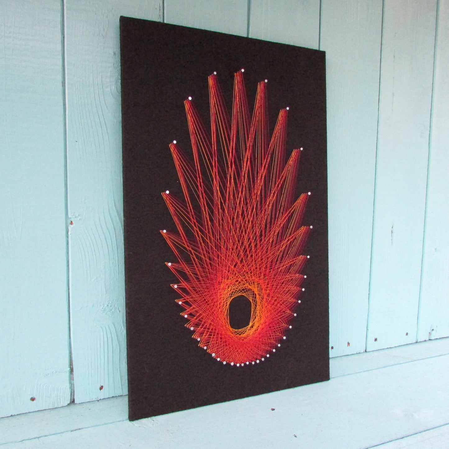 Home-made "Starburst" string art made from original 1973 pattern, black background