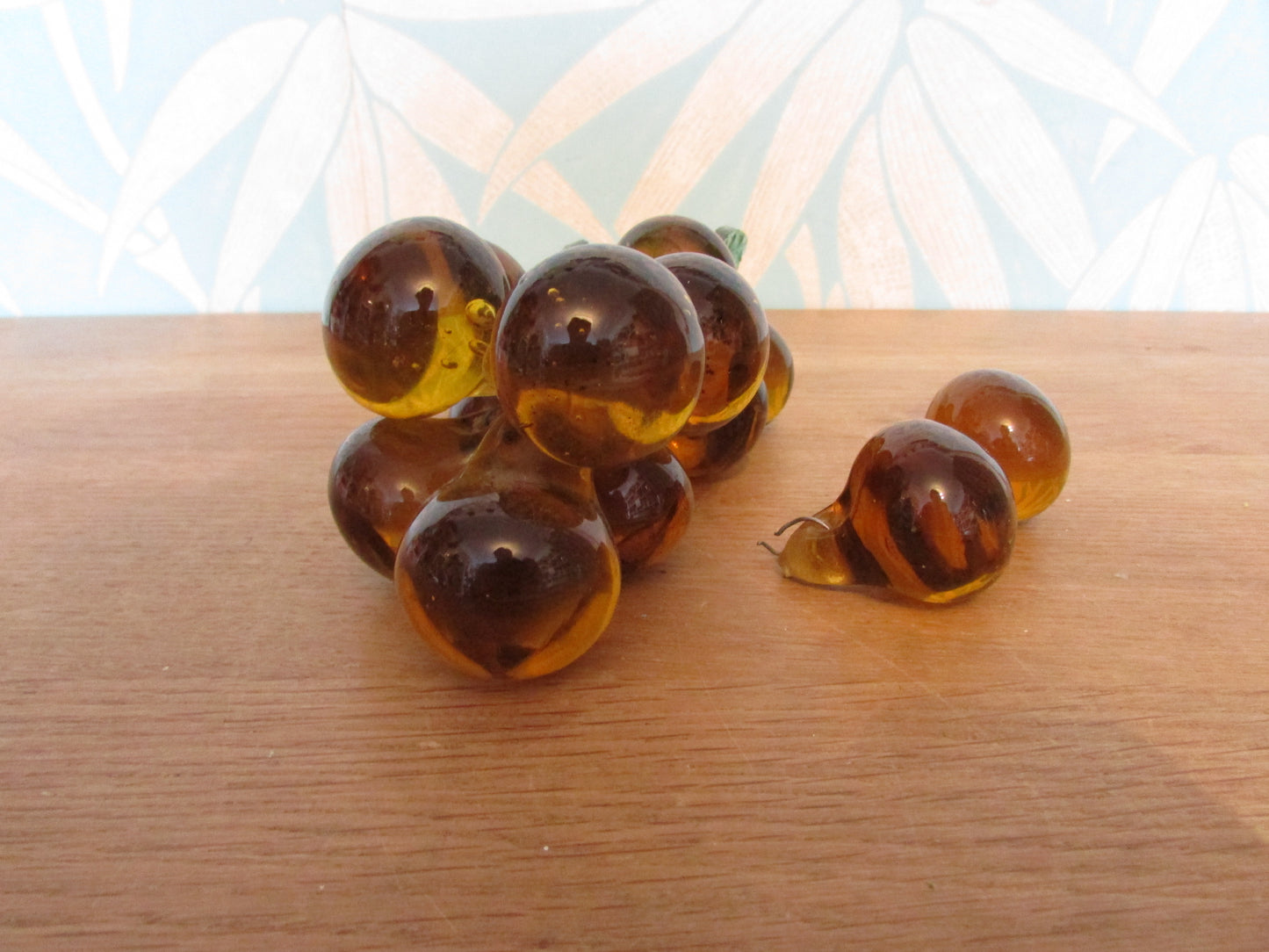 Mid-century Murano-style amber glass large grape cluster with green glass leaves