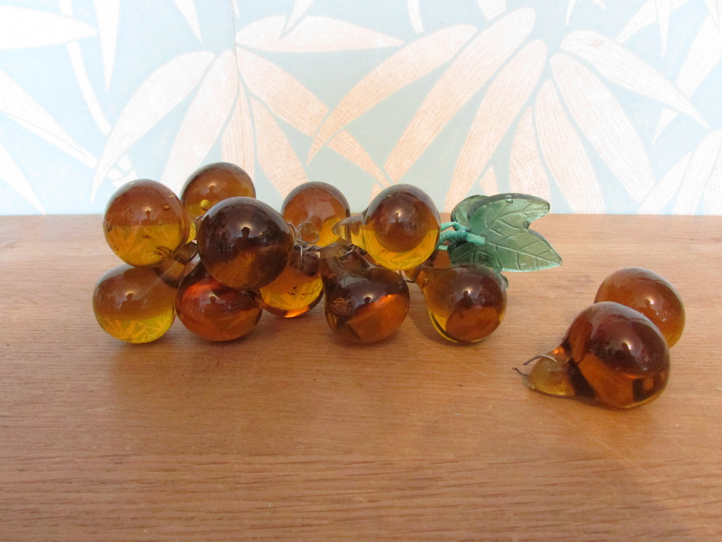 Mid-century Murano-style amber glass large grape cluster with green glass leaves