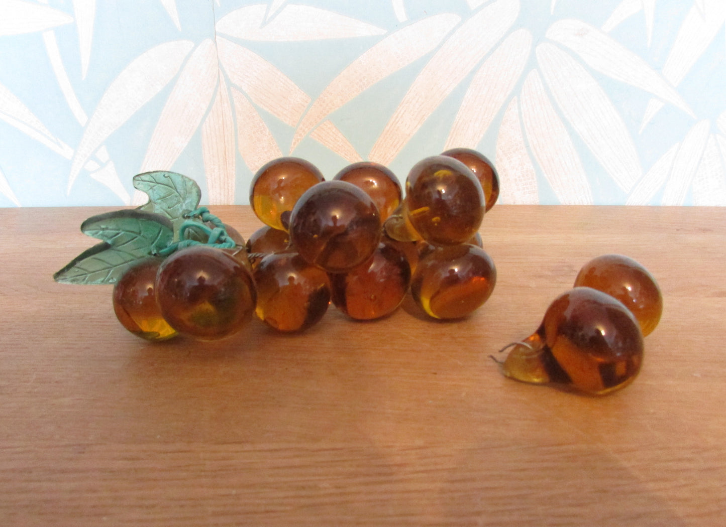 Mid-century Murano-style amber glass large grape cluster with green glass leaves
