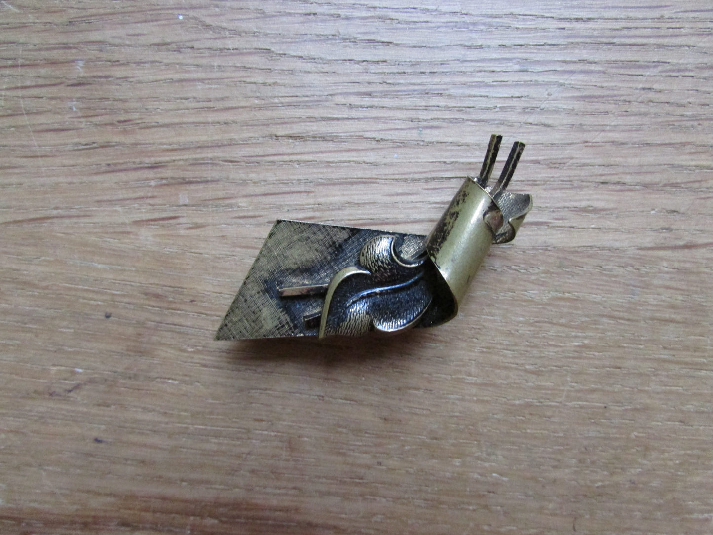 Vintage German gold-tone scroll leaf brooch