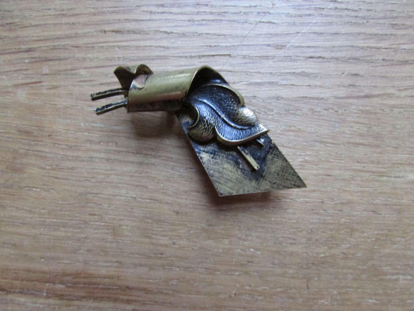 Vintage German gold-tone scroll leaf brooch