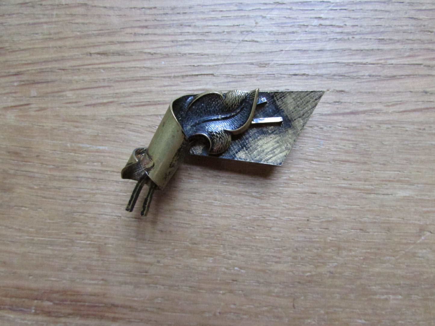 Vintage German gold-tone scroll leaf brooch