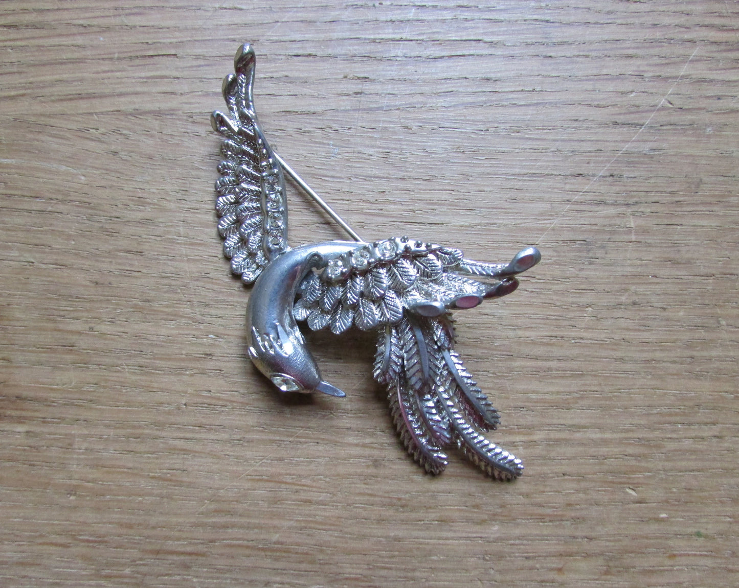 Vintage large silver-tone bird in flight brooch with textured feather detail & diamanté eye