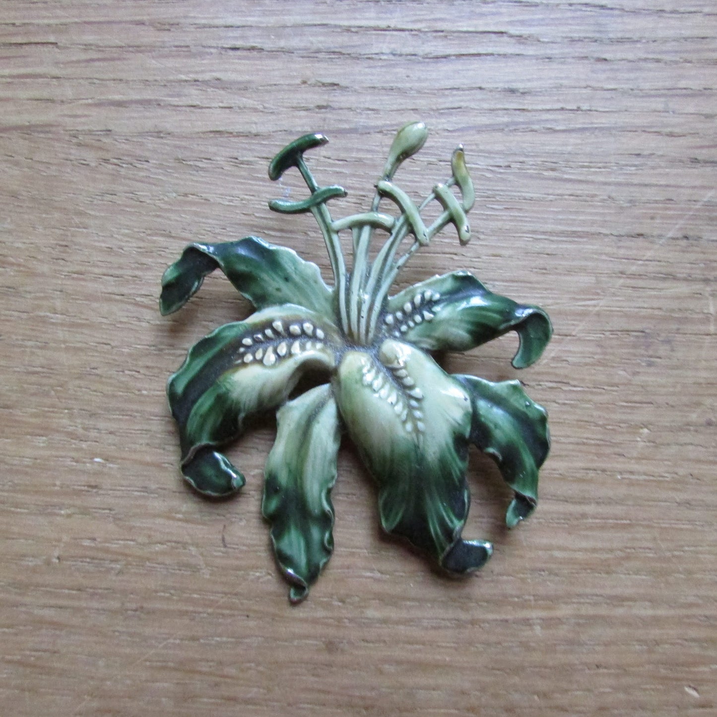 Large 1960s Art Nouveau-inspired enamelled metal lily brooch
