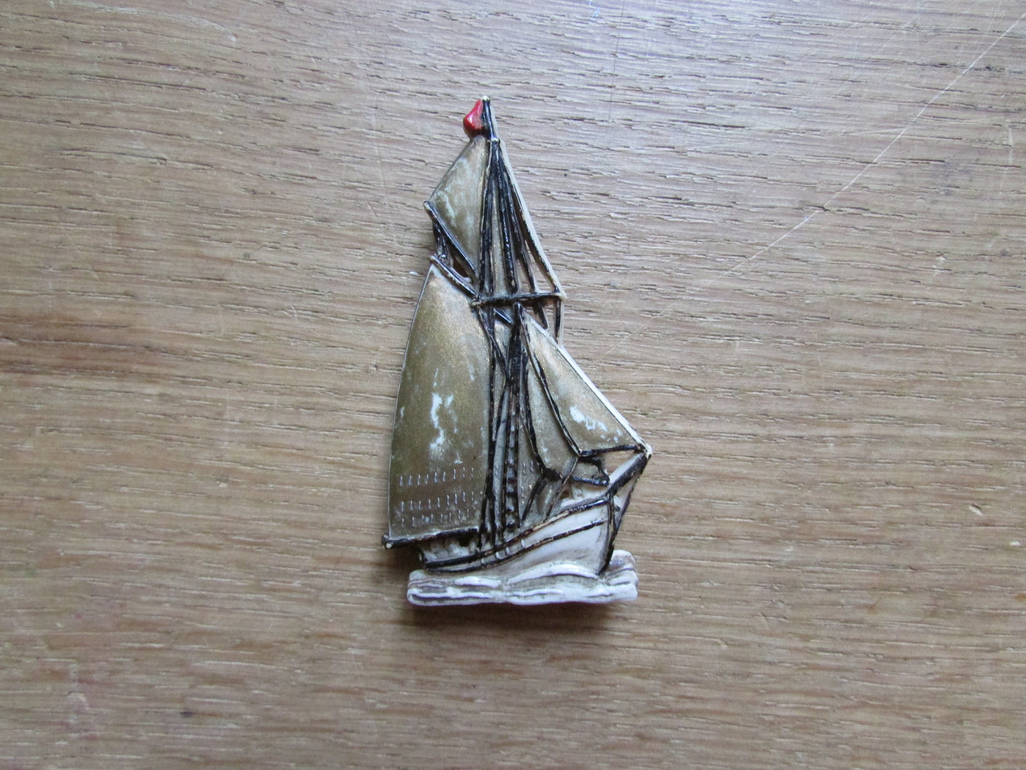 Vintage plastic tall ship brooch, stamped Made in England