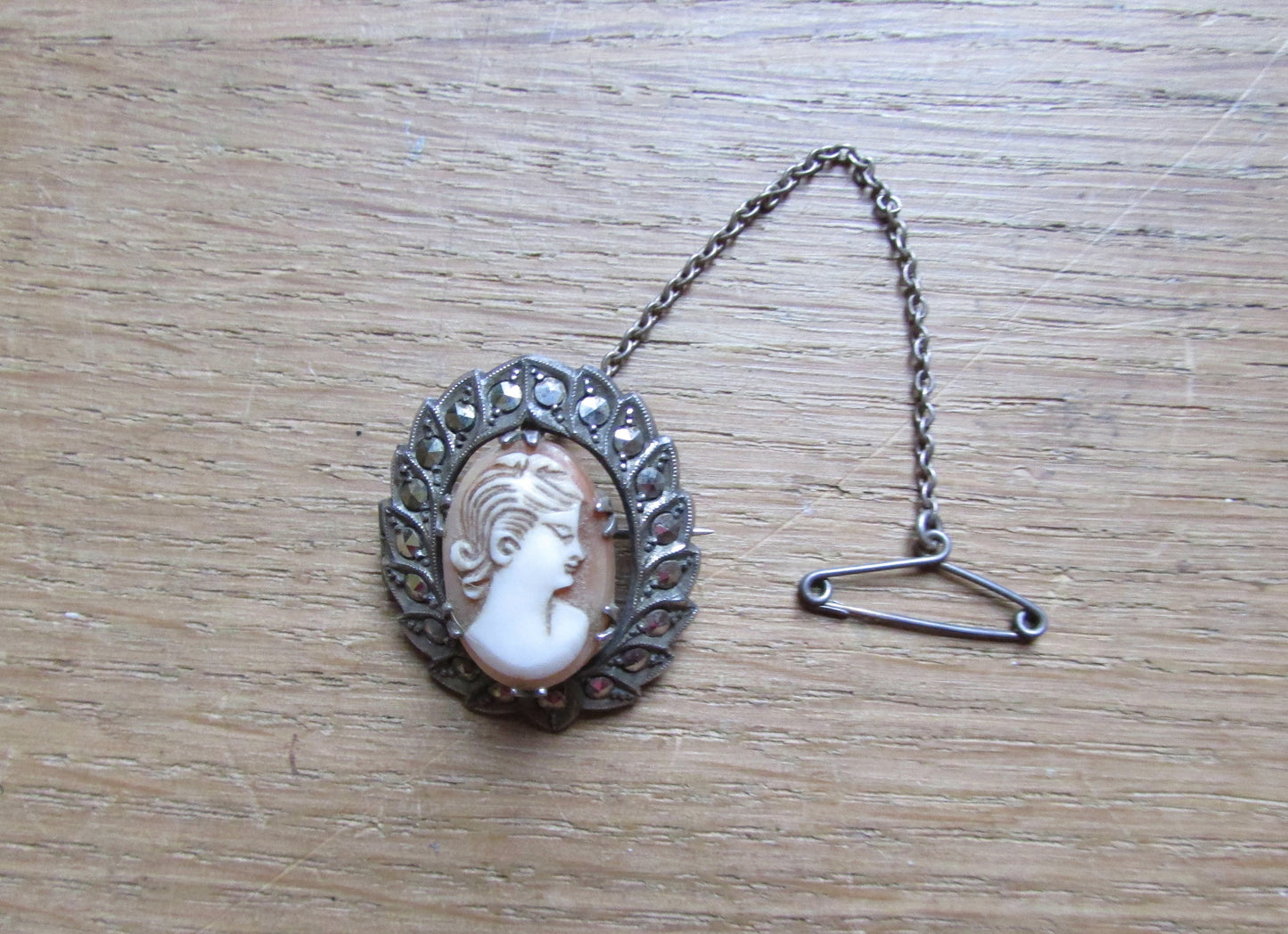 Victorian silver marcasite cameo wreath brooch with safety chain