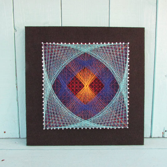 Home-made "Square" string art made from original 1973 pattern, black background